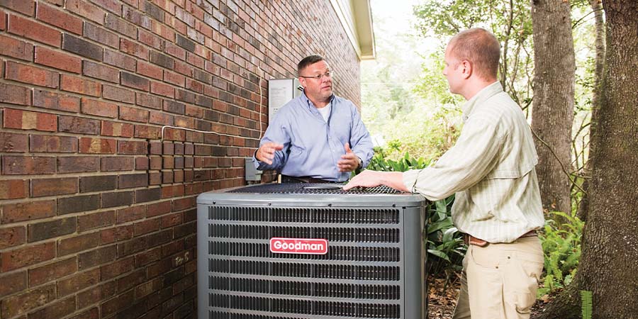 tech and homeowner discussing hvac services
